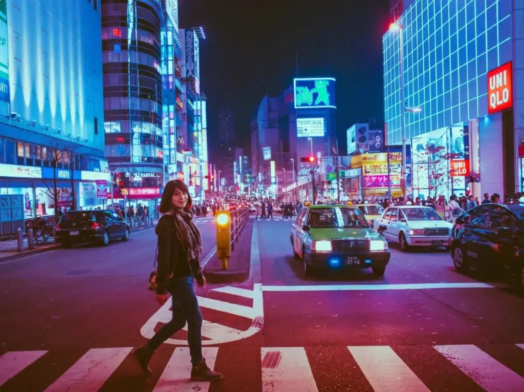 Nightlife scene in Umeda Osaka with a woman crossing the street